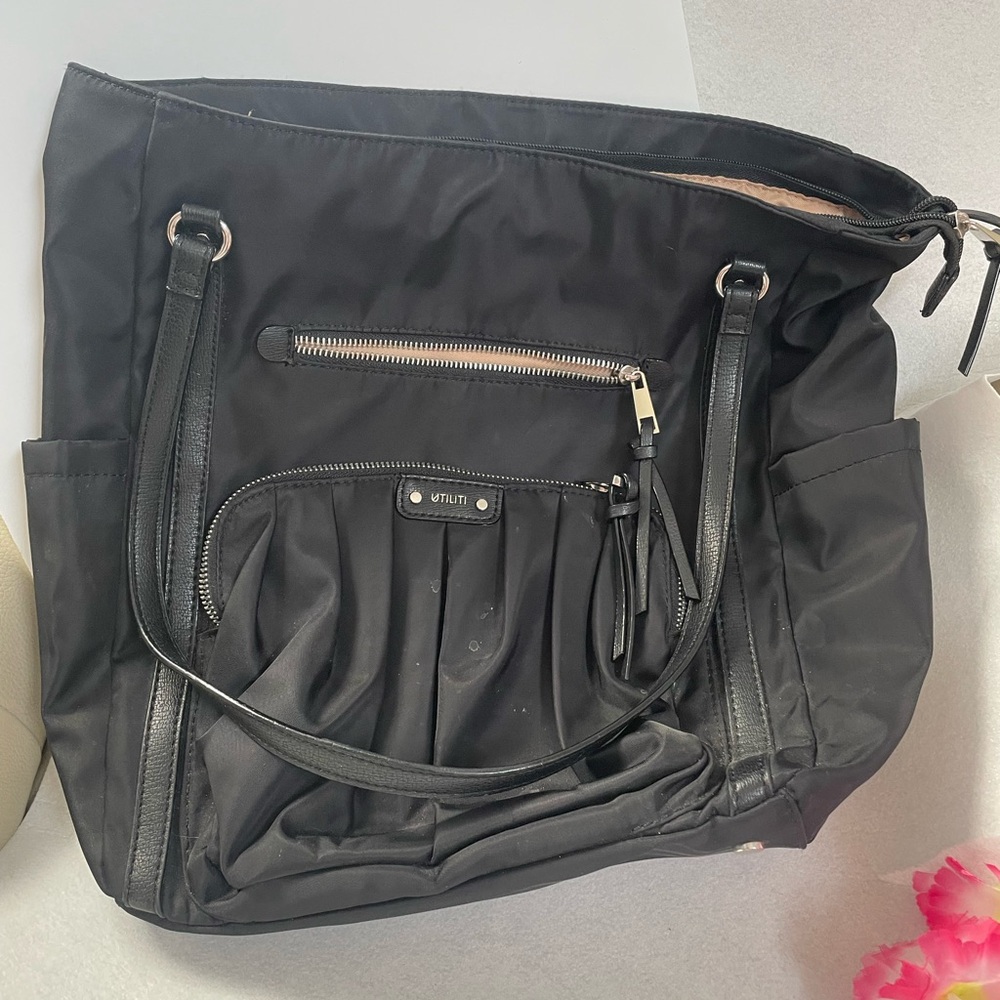 Great bag! Roomy, trolley strap, lightweight. Water resistant. Like new.